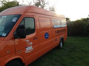 Water Damage And Mold Removal Van At Dusk