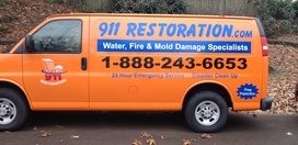 Water Damage Restoration Van At Fall Residential Job Site With Fallen Leaves